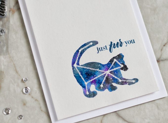 Create an interesting card for a cat lover by using negative mask to create a galaxy piece and then white emboss simple drawn constellation. With Altenew Modern Cats Card by @craftwalks.